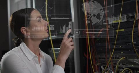 Female IT Technician Interacting with Holographic Network Interface in Data Center Rack