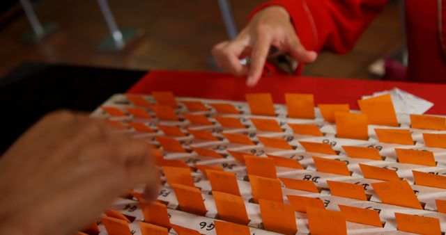 Hands Picking Origami Fortunes at Japanese Temple - Download Free Stock Images Pikwizard.com