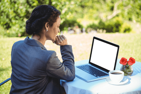 Businesswoman Thinking with Transparent Laptop Screen Outdoors