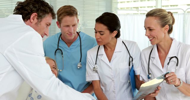 Medical Team Discussing Patient Diagnosis in Hospital Room - Download Free Stock Images Pikwizard.com