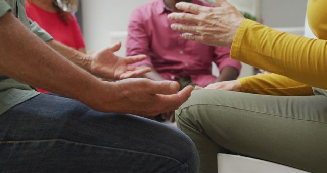 Image of midsection of diverse seniors holding hands during support group meeting - Download Free Stock Photos Pikwizard.com
