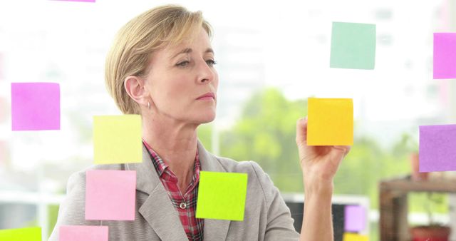 Focused Professional Planning with Colorful Sticky Notes - Download Free Stock Images Pikwizard.com