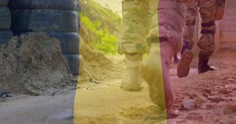 Soldiers Marching on Dusty Trail in Camouflage Boots with Tricolor Overlay