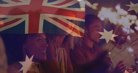 Diverse friends celebrating with australian flag and sparklers