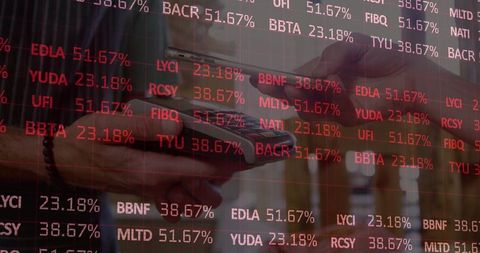 Trader using mobile app with stock market ticker overlay