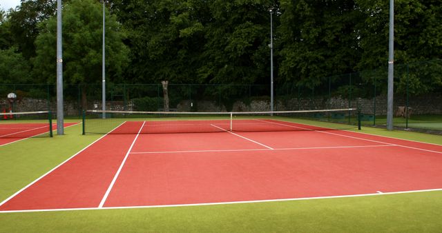 Empty Red and Green Tennis Court in Natural Setting - Download Free Stock Images Pikwizard.com