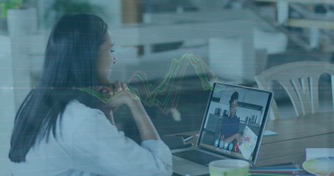 Business Woman Engaging in Virtual Meeting with Data Analytics Overlay