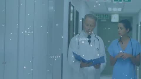 Doctor and Nurse Collaborating with Digital Analytics in Hospital Corridor