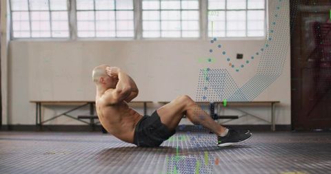 Shirtless male athlete performing crunches on gym floor with digital data overlay