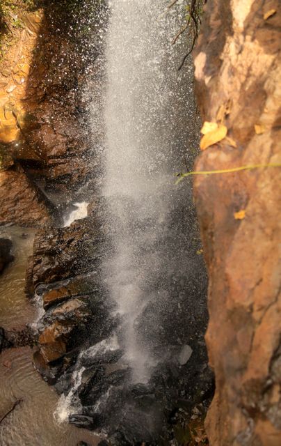 Close-Up View of Waterfall Cascading Over Rocky Cliff - Download Free Stock Photos Pikwizard.com