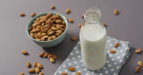 Almond Milk and Almonds Composition on Grey Background - Download Free Stock Images Pikwizard.com