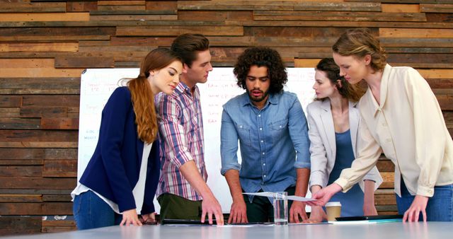 Diverse Team Collaborating During Business Meeting Around Table - Download Free Stock Images Pikwizard.com