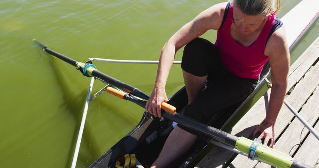 Athletic Woman Preparing for Rowing in Water - Download Free Stock Images Pikwizard.com