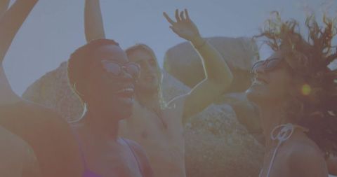 Friends Enjoying Beach Day Fun in Sunglasses