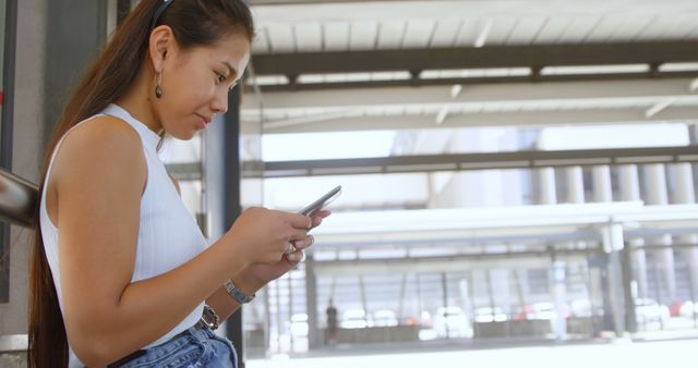 Woman Using Smartphone in Modern Urban Environment - Download Free Stock Images Pikwizard.com