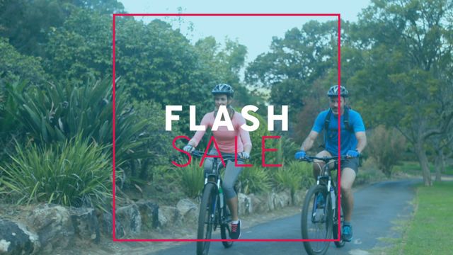 This vibrant video with animated 'Flash Sale' text over a couple riding bikes through a scenic nature path is ideal for marketing and promotional campaigns. Perfect for conveying energy and excitement in retail and ecommerce advertising, fitness brand promotions, and outdoor activity equipment sales.