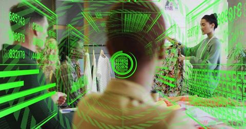 Boutique shopper using augmented reality interface while staff showing patterned dress
