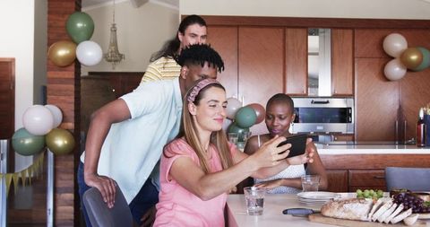 Friends Taking Selfie in Kitchen During Relaxed Gathering