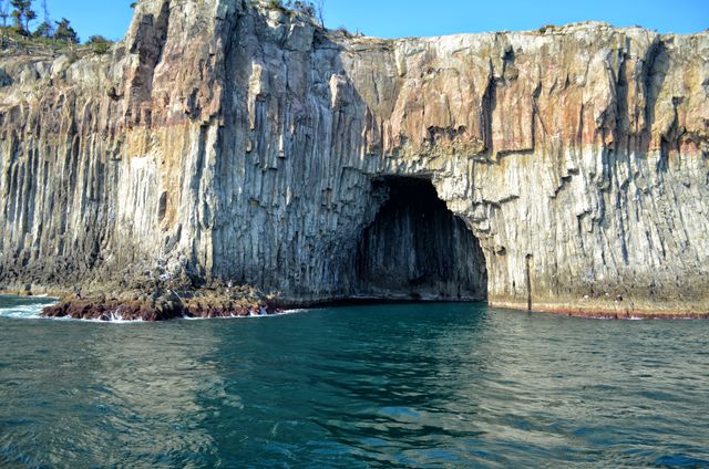 Stunning Basalt Cave Entrance in Rocky Coastal Cliff - Download Free Stock Photos Pikwizard.com