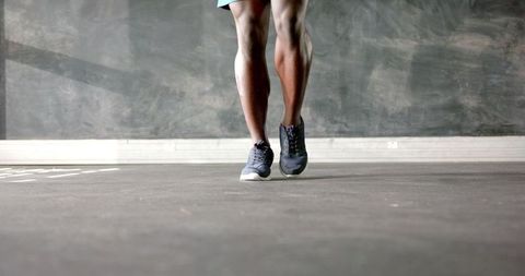 Focused Athletic Training Indoors by Determined Runner