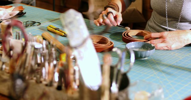 Craftsman Working on Leather Pieces in Workshop - Download Free Stock Images Pikwizard.com