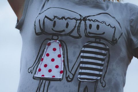 Creative cartoon t-shirt design with hand-holding characters