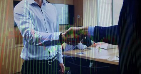 Executive handshake sealing deal with financial data overlay in corporate boardroom