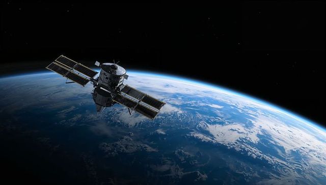 High-Detail Satellite Orbiting Earth with Dual Solar Arrays over Blue Planet Horizon