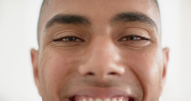 Close Up of Smiling Man's Face with Bright Expression - Download Free Stock Images Pikwizard.com