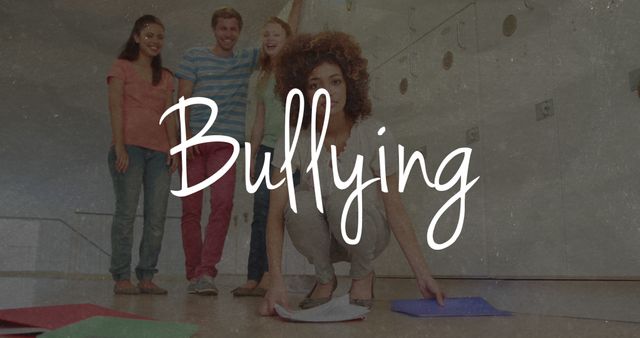 Image of the word Bullying over sad female student dropping books with group of male and female college students laughing at her in the background. Education bullying concept digital composite.