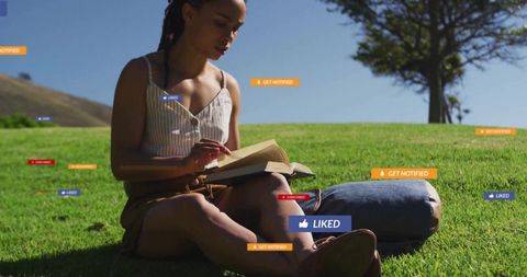 Woman Reading Book in Scenic Outdoor Setting Among Social Media Alerts