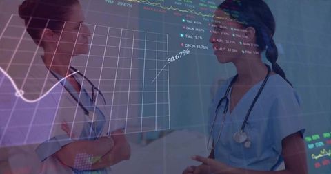 Clinicians reviewing digital medical charts with analytics overlay, collaborating in clinic
