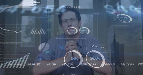 Financial Data Overlay on Businessman in Modern Office