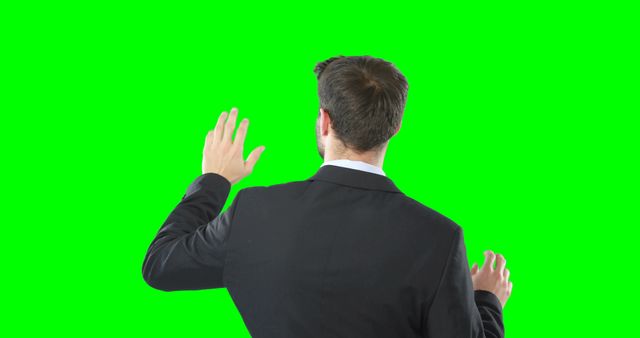 Businessman Back View Gesturing Video Conferencing Green Screen - Download Free Stock Images Pikwizard.com