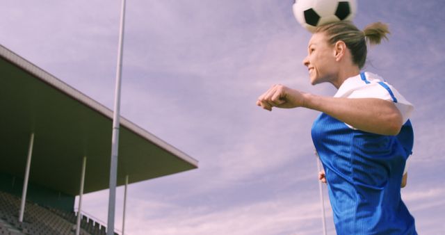 Female Soccer Player Heading Ball During Match - Download Free Stock Images Pikwizard.com