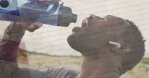 Man with American Flag Overlay Drinking Water in Mountain Scenery - Download Free Stock Images Pikwizard.com