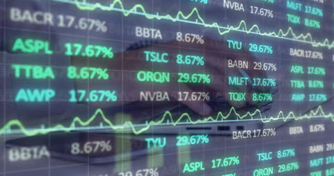 Hands Typing on Laptop with Digital Stock Data Overlay