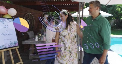 Poolside backyard celebration on deck with friends, floral dress and data overlay graphics