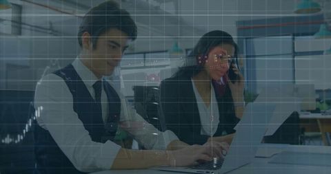 Business Team Analyzing Data with Laptops in Corporate Office