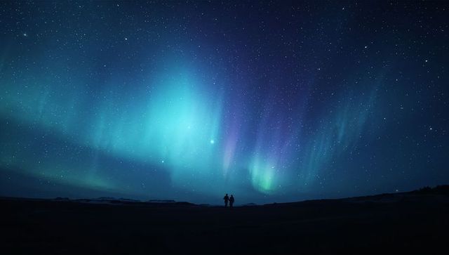 Silhouetted Figures Under the Northern Lights in Stargazing Spectacle