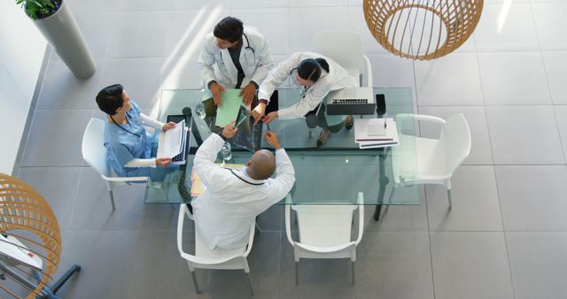 Healthcare Team Discussing at Meeting in Modern Hospital - Download Free Stock Images Pikwizard.com