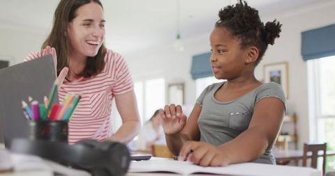 Happy Mother Helping Daughter with Homework Home Education - Download Free Stock Images Pikwizard.com