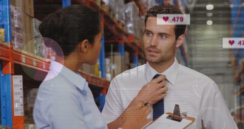 Diverse coworkers analyzing data in warehouse setting