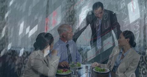 Business Team Analyzing Financial Market Over Light Lunch