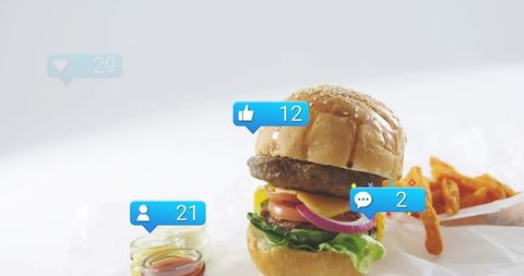 Stacked cheeseburger with fries social media reaction badges white high-key background