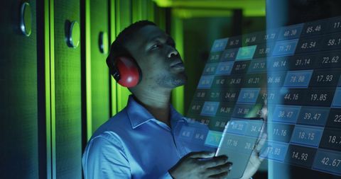 IT Engineer Analyzing Financial Data Hologram in Server Room - Download Free Stock Images Pikwizard.com
