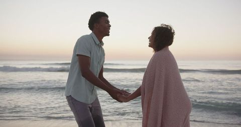 Romantic Couple Enjoying Sunset by the Sea
