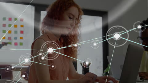 Digital Network of Connections Overlaying Busy Businesswoman