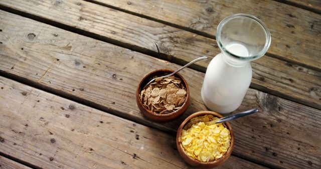 Healthy Breakfast with Milk, Cornflakes and Bran Flakes on Rustic Wooden Table - Download Free Stock Images Pikwizard.com