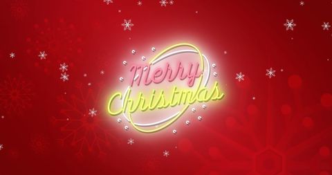 Illuminated merry christmas sign with falling snowflakes